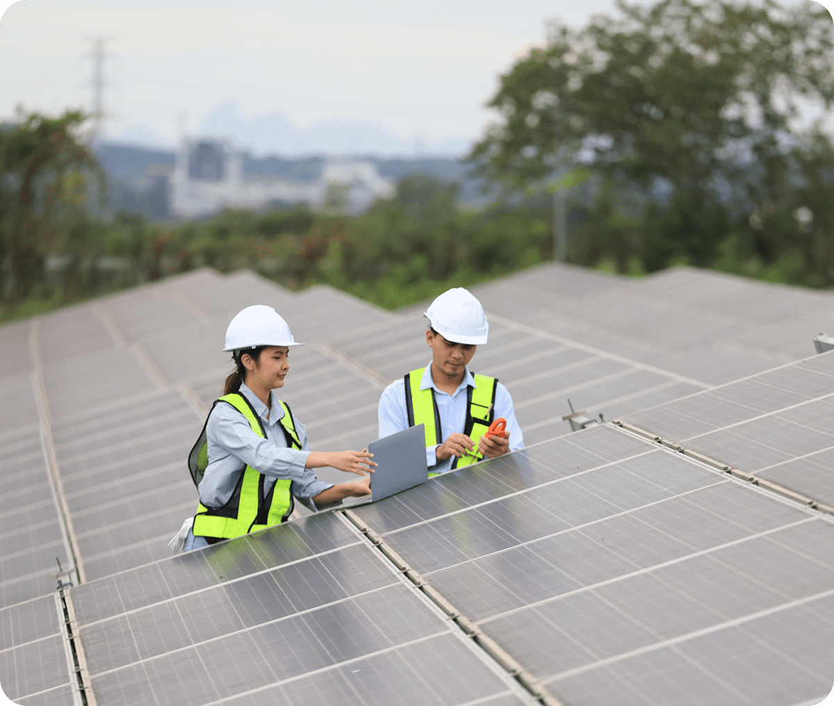 Technicians inspecting solar panels with equipment